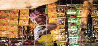 A market vendor selling soap products supported by a HOFAD entrepreneurship program
