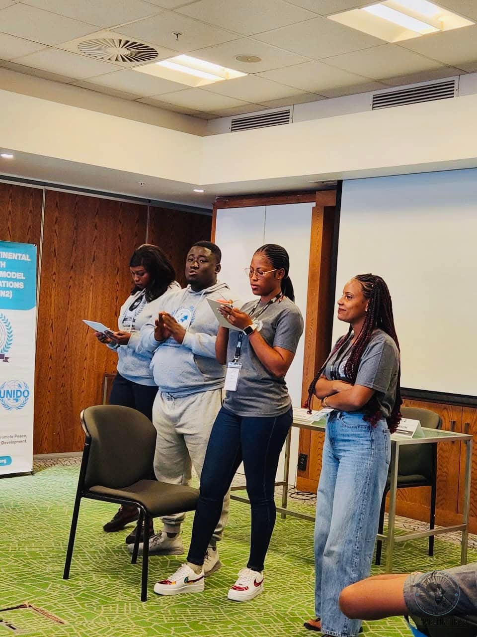 HOFAD-supported youth presenting at a Continental Youth Model United Nations session